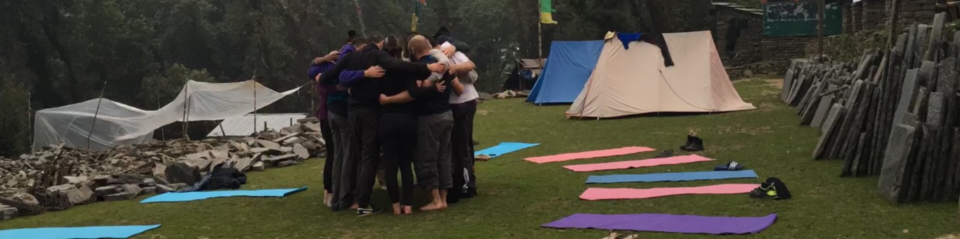 Thailand retreat group circle embracing in nature